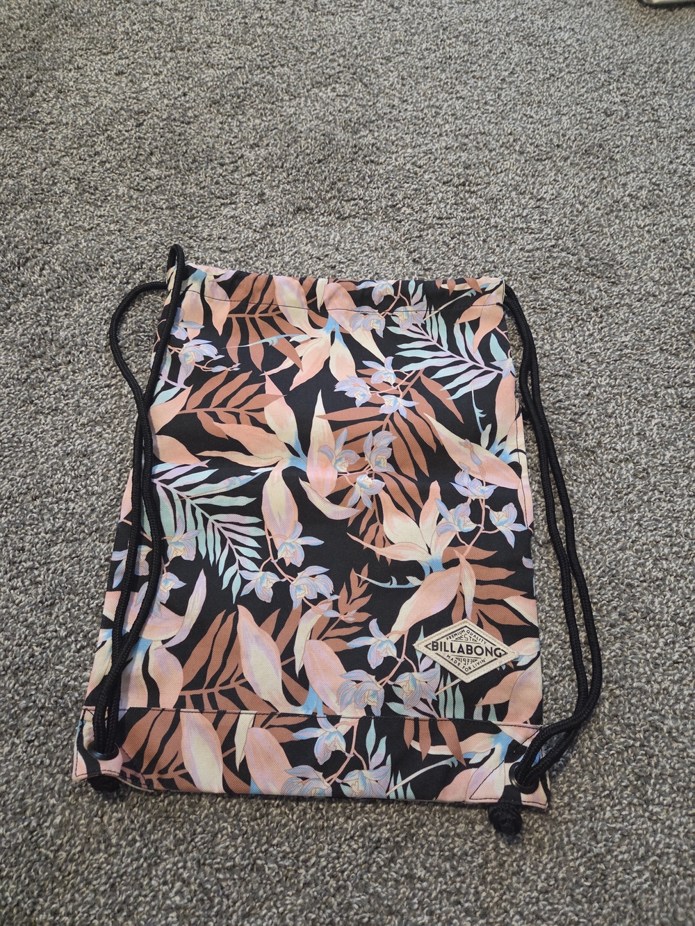 Billabong Floral Drawstring Backpack in Black and Peach-Tones